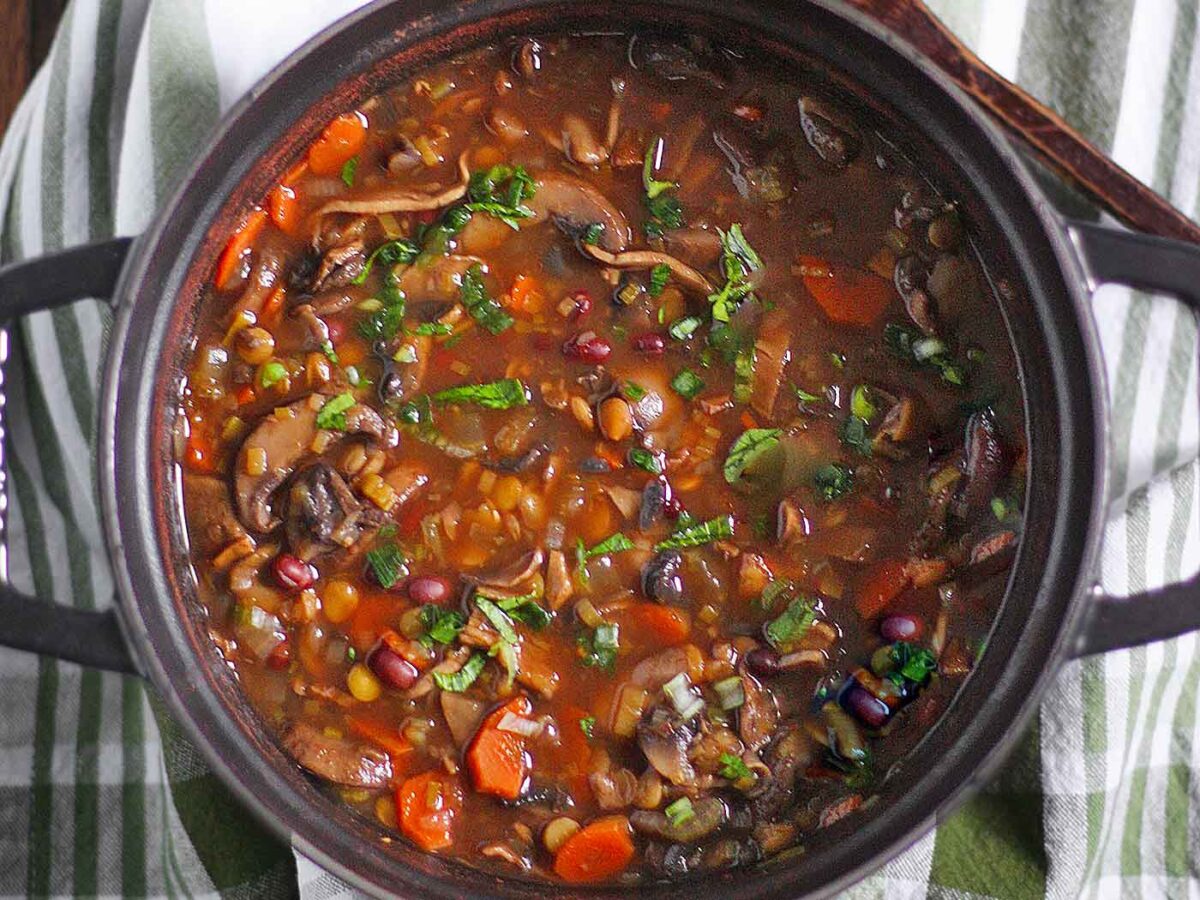 Mushroom Lentil Adzuki Bean Soup in a large black Dutch oven.