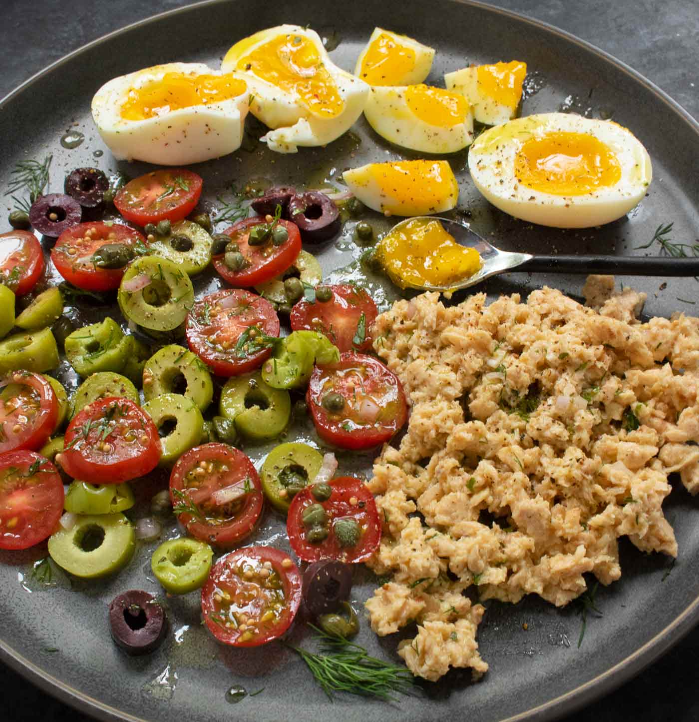 The Nicoise toppings on the plate ready to add to the fried toast.