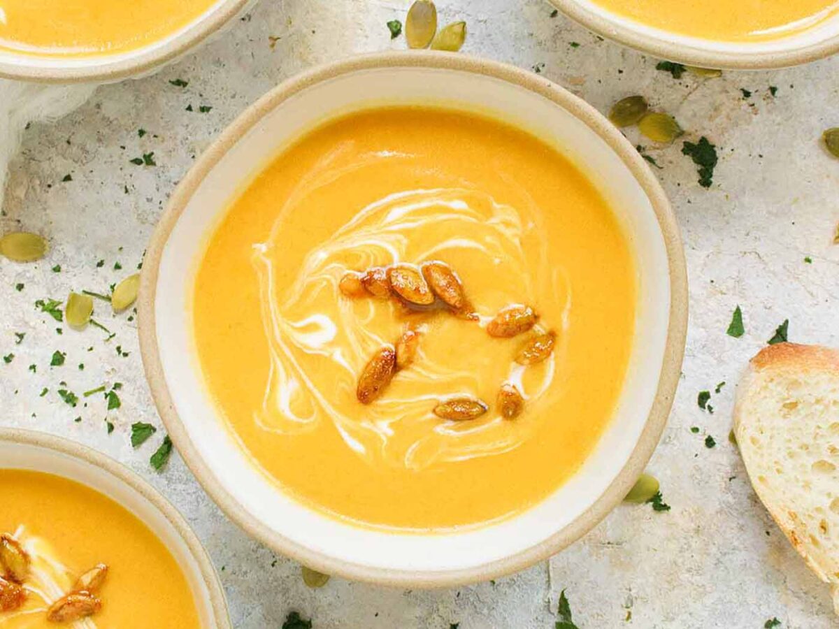 Panera Autumn Squash Soup in a bowl with pepita toppings.