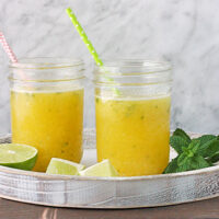 Party Pineapple Orange Mojitos from SoupAddict.com. Do-ahead mojitos in mason jars that go right in the ice bucket for your outdoor party!