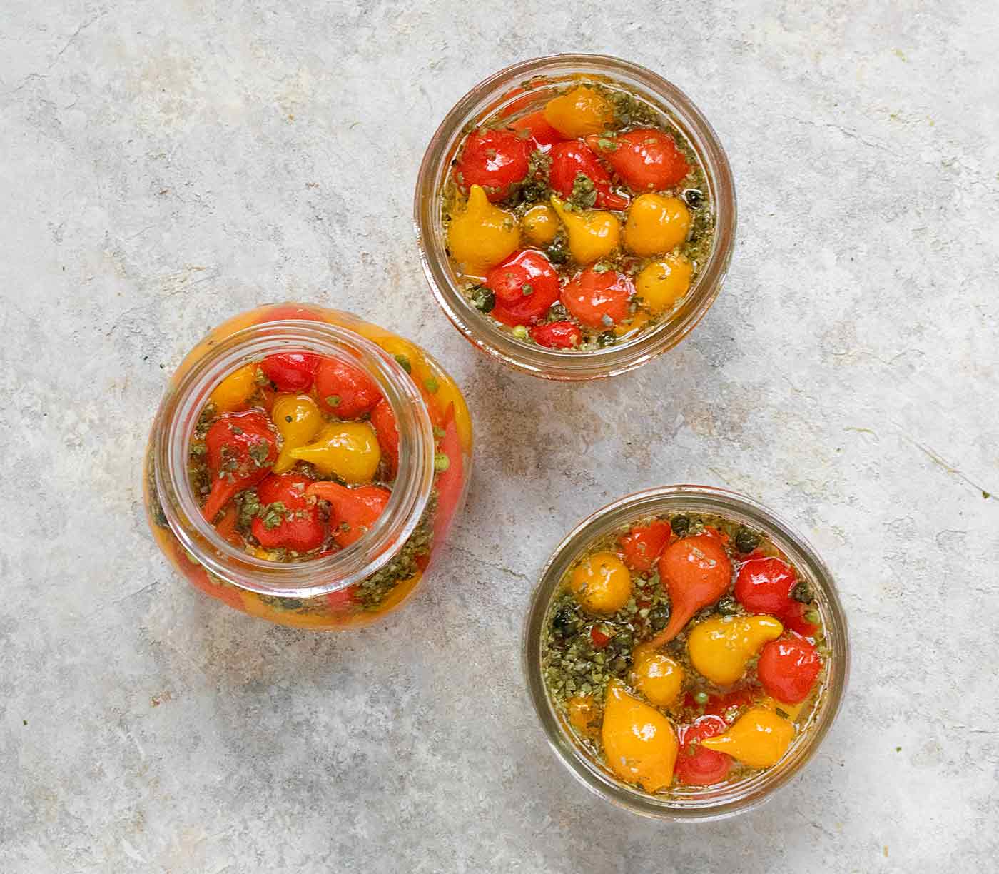 Three jars of pickled sweety drops, photographed from above