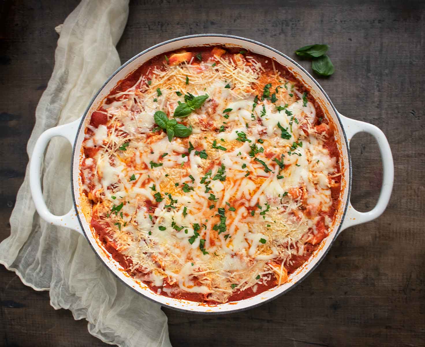 Overhead view of Pizza Tortellini in a white braiser.