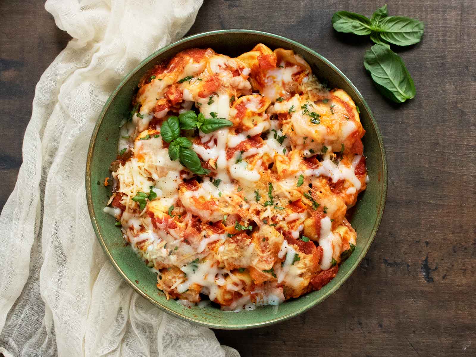 Overhead view of Pizza Tortellini in a green bowl.