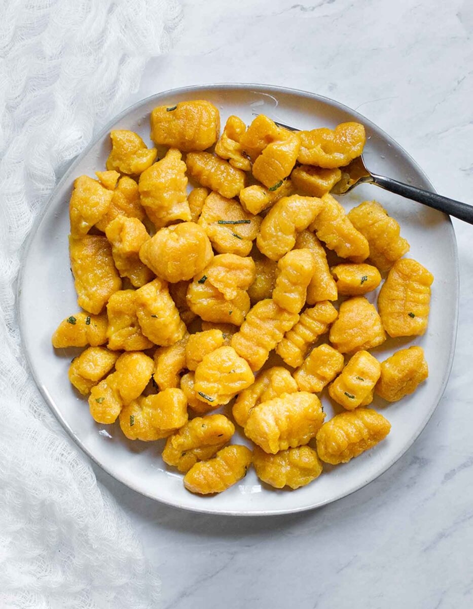 Pumpkin gnocchi on a plate.