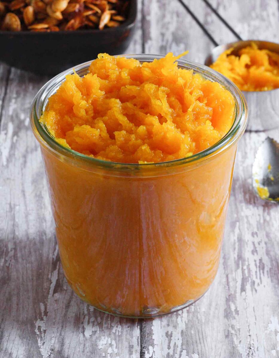 Pumpkin puree in a glass jar.