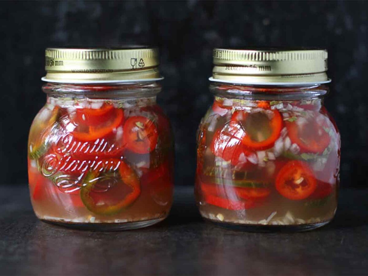 Two jars of refrigerator pickled jalapenos.
