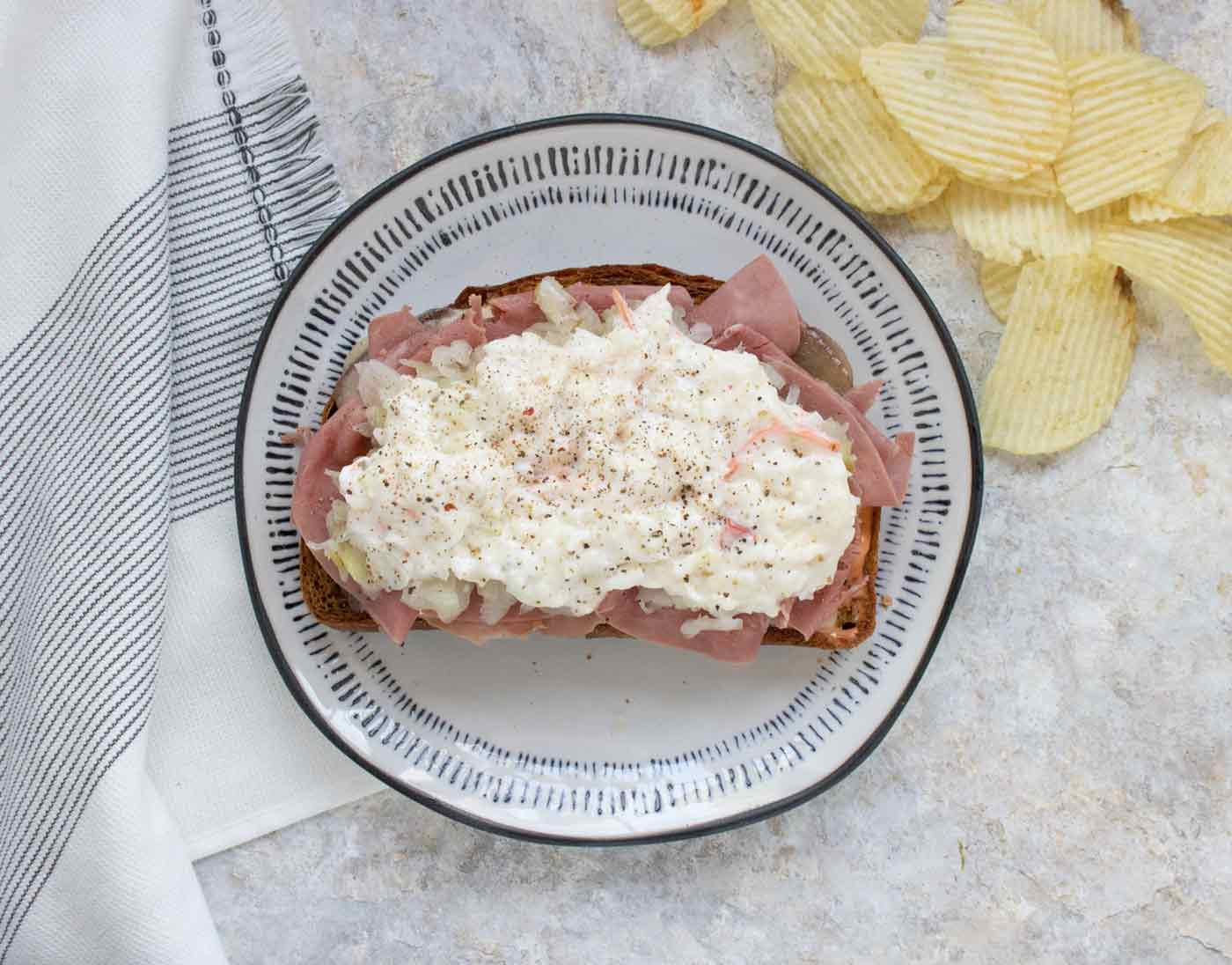 Reuben Fried Toast on a gray plate with black trim.