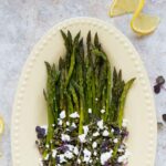 Roasted asparagus on a serving platter.