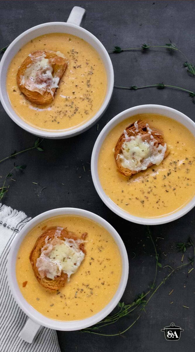 Pinterest pin image featuring three bowls of Roasted Winter Squash and Feta Soup.