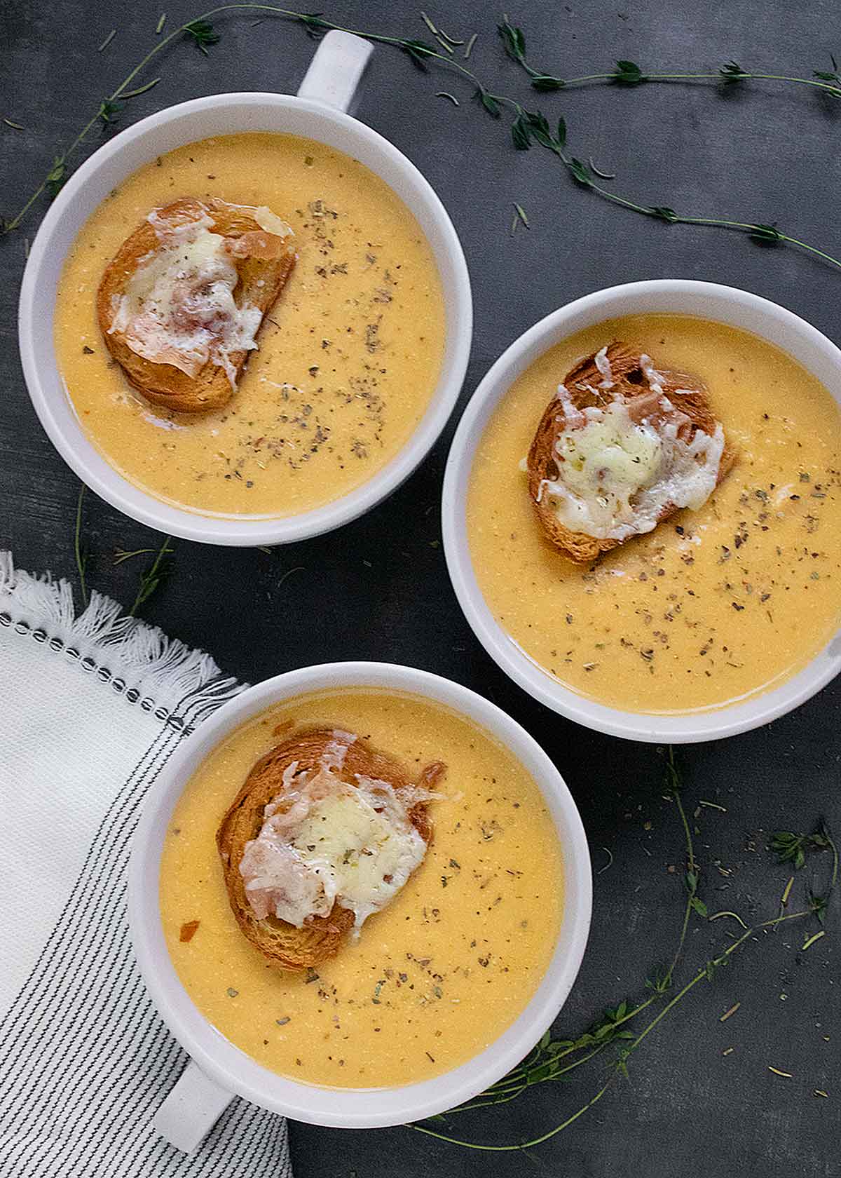 Three bowls of Roasted Winter Squash and Feta Soup.