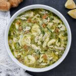 Overhead view of a bowl of Rotisserie Chicken Tortellini Soup.