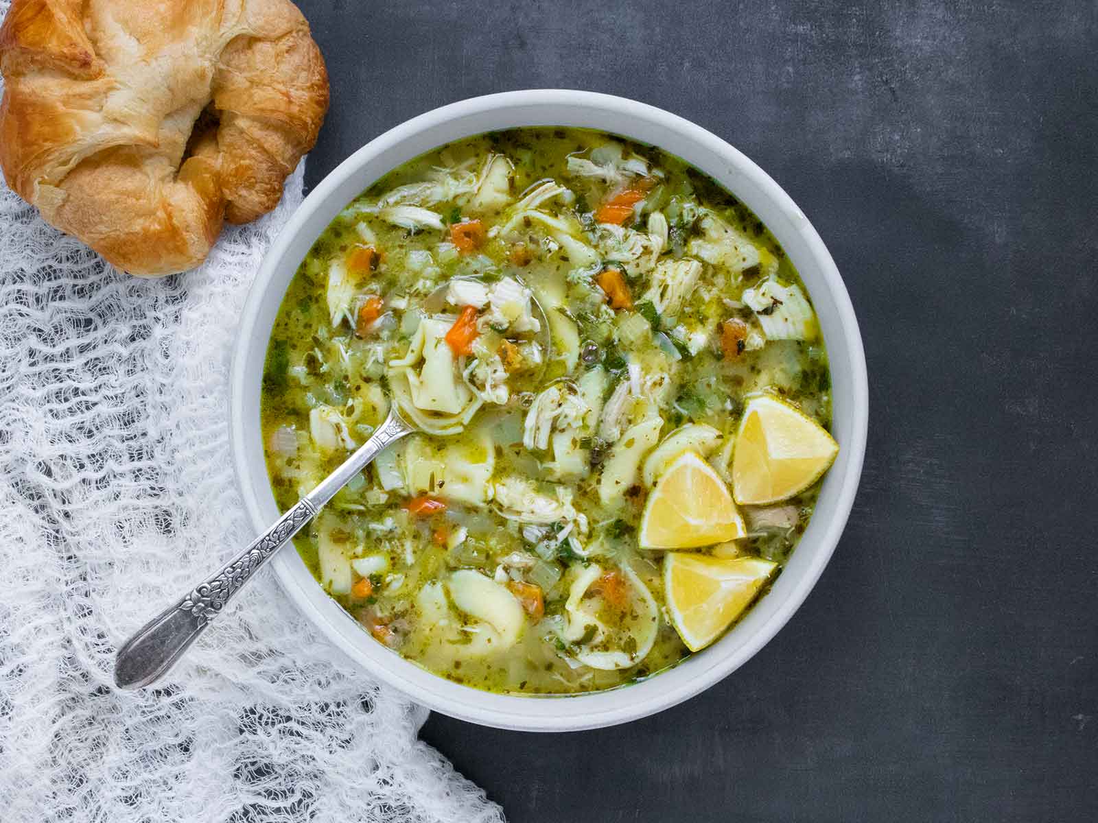 Overhead view of a bowl of Rotisserie Chicken Tortellini Soup.