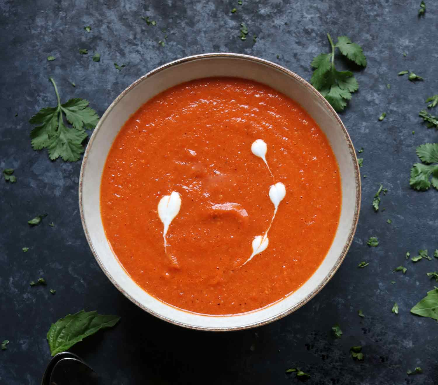 A bowl of Sheet Pan Roasted Red Pepper Tomato Soup.
