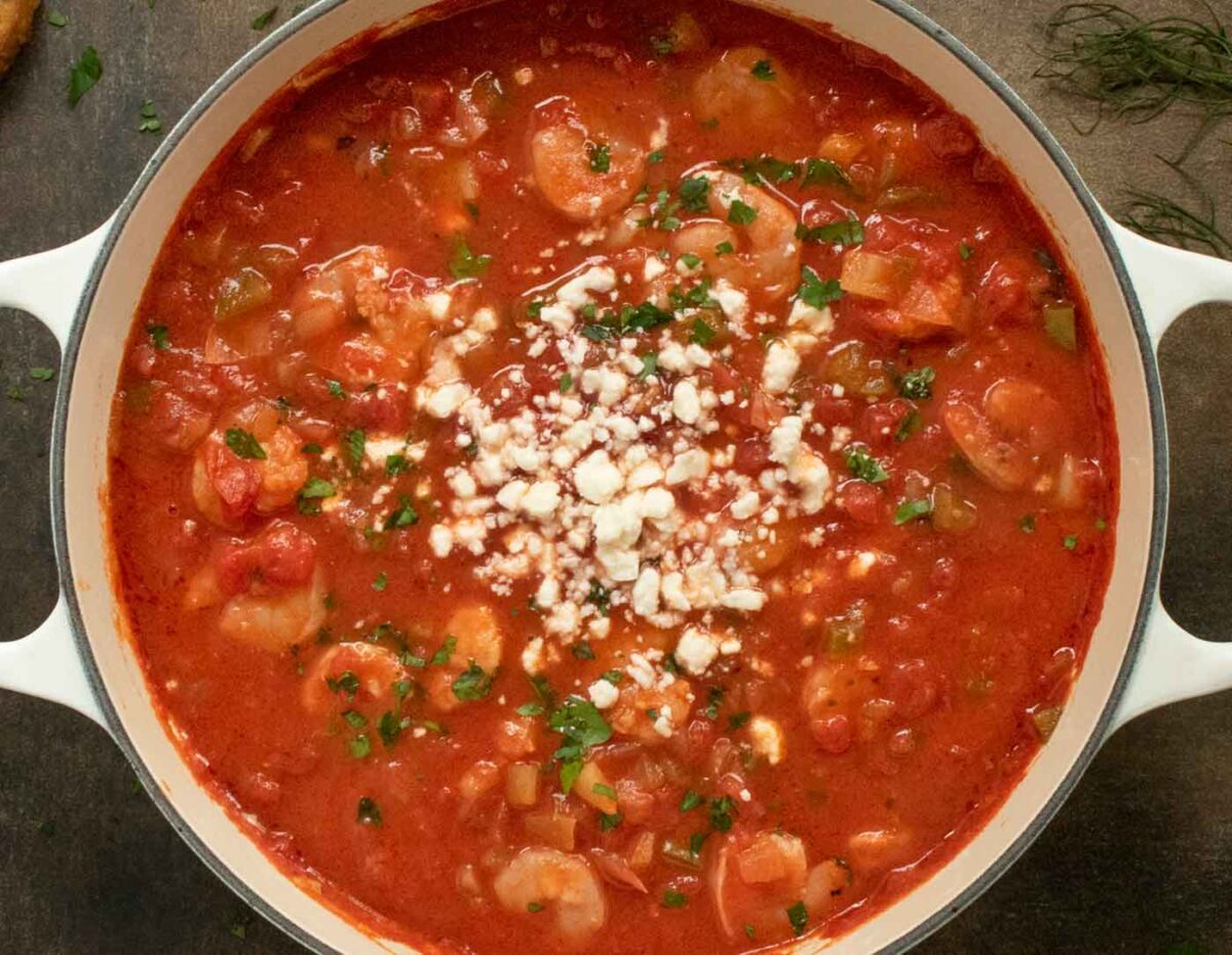 The finished soup, garnished with feta cheese and minced parsley.