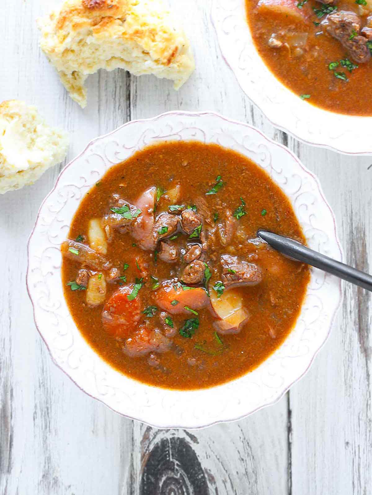 Overhead view of Slow Cooker Guinness Beef Stew in a white bowl.