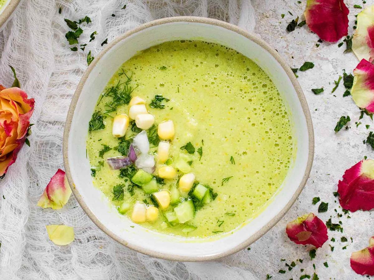 Overhead view of Smoke Corn Gazpacho in a white bowl.