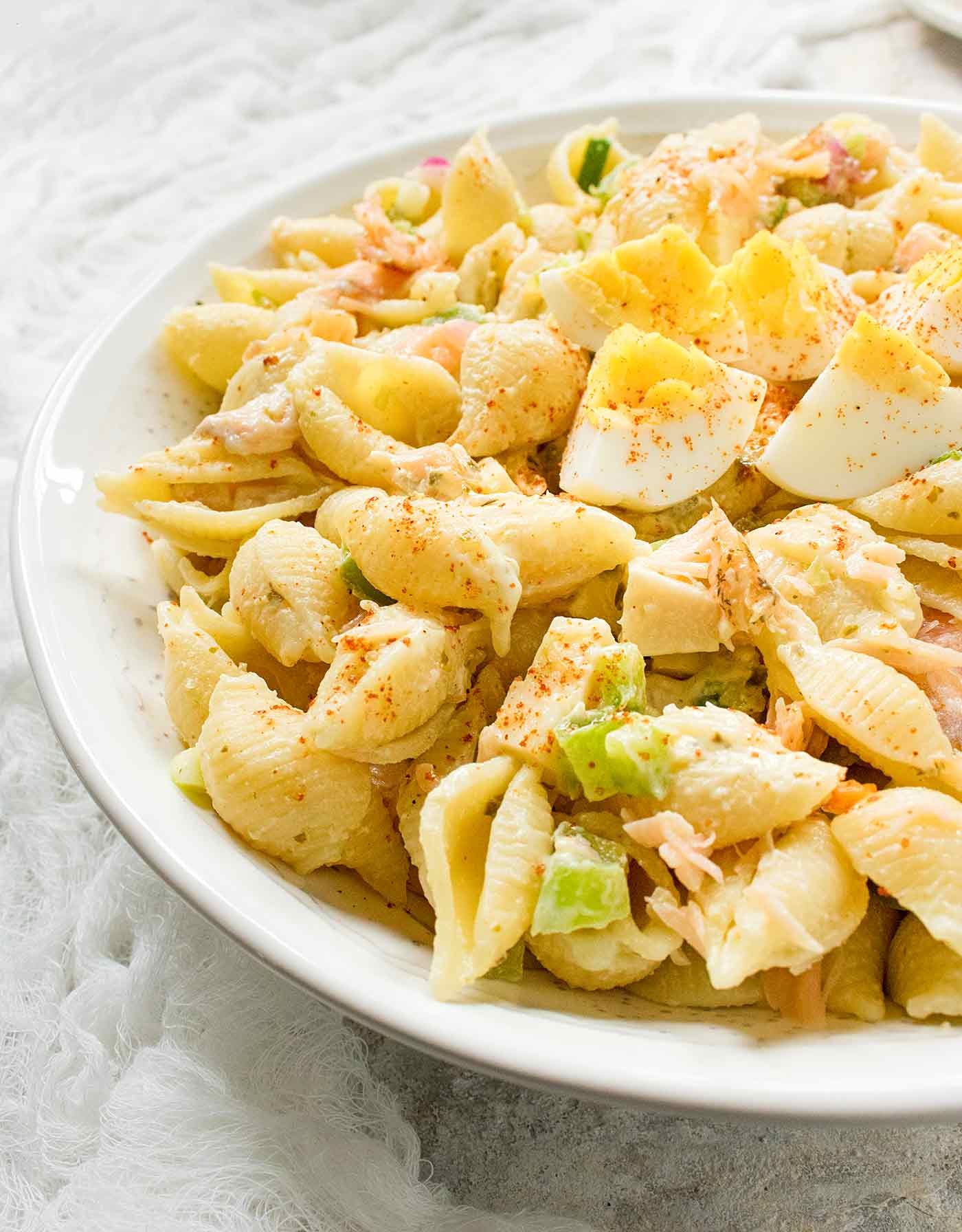 Close-up of Smoked Salmon Pasta Salad in a white serving bowl