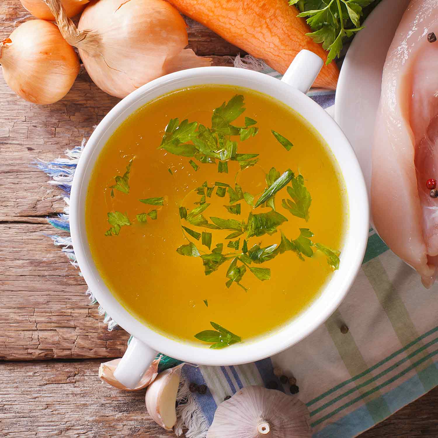 Soup stock in a white bowl.