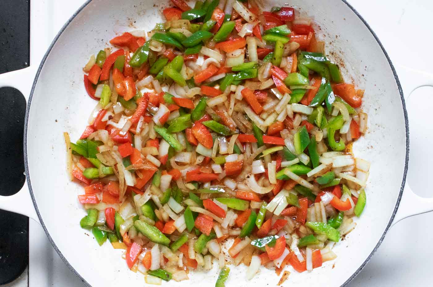 Aromatic vegetables cooking in the pot.