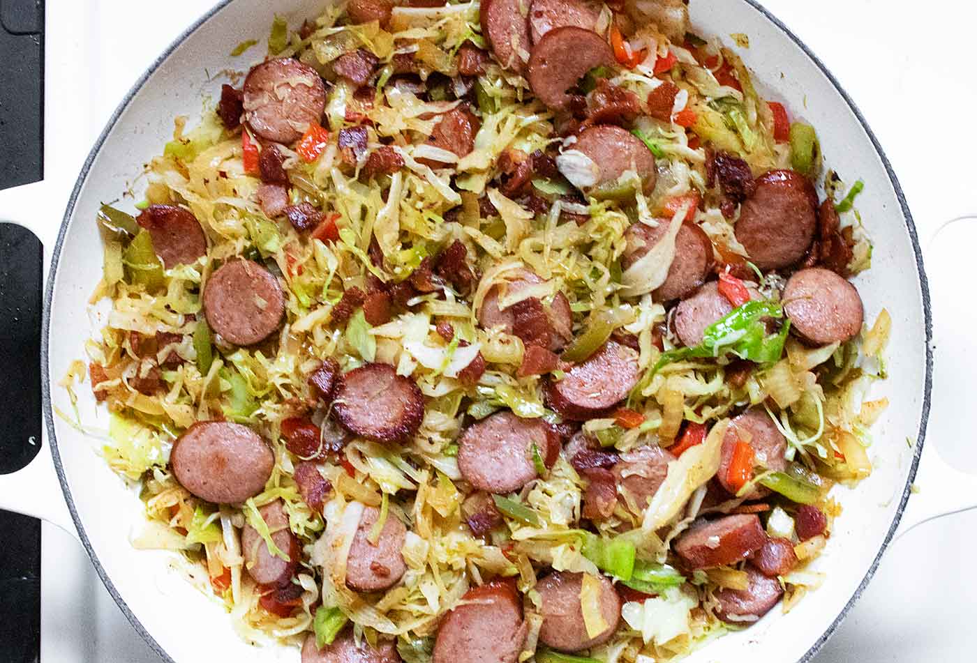 Bacon and sausage goes back in the pot, and it's ready to serve.