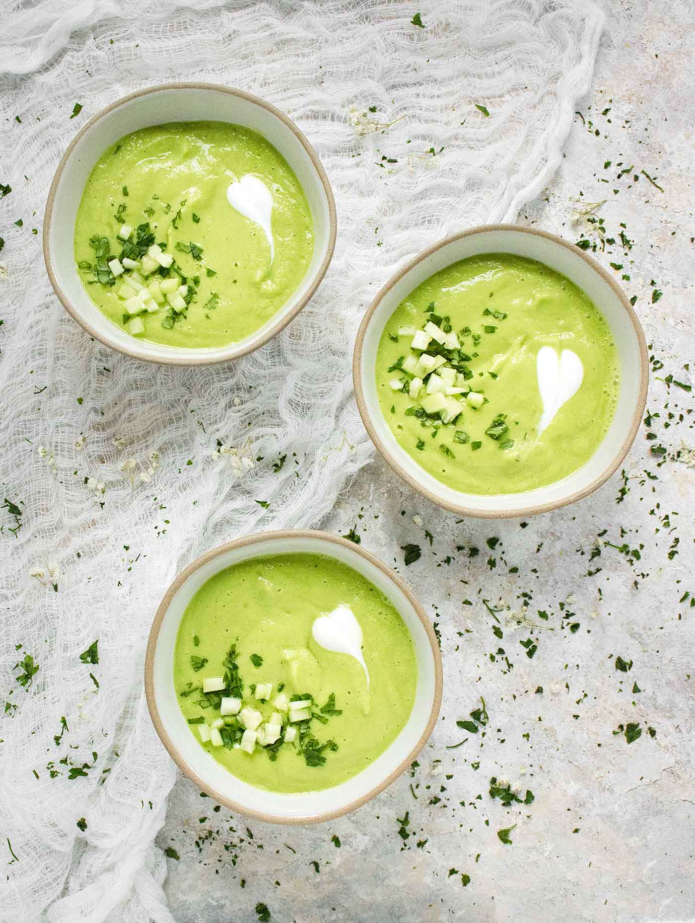 Three bowls of Spicy Green Goddess Gazpacho