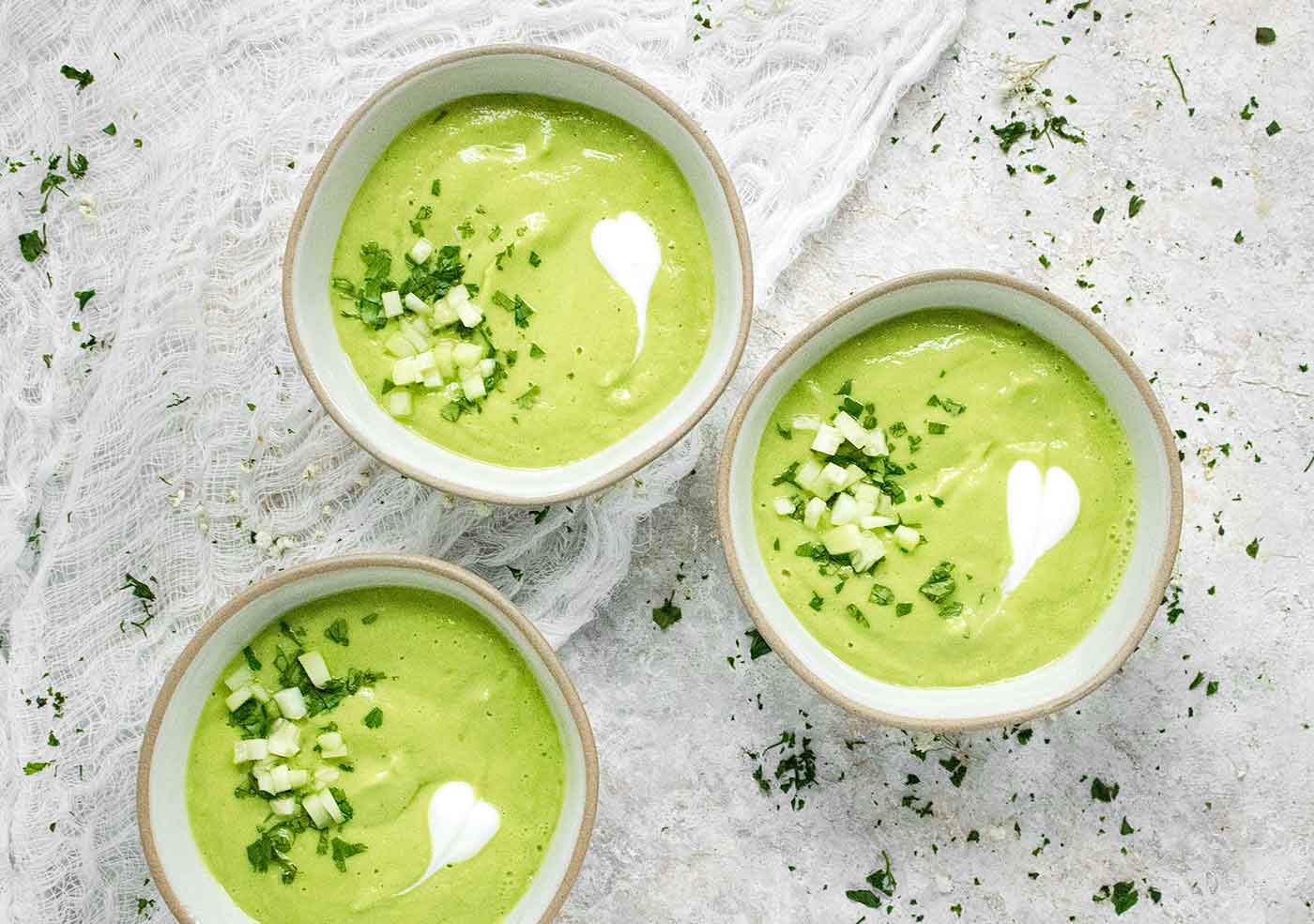 Three bowls of Spicy Green Goddess Gazpacho