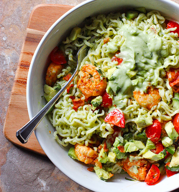 Ready to eat Spicy Shrimp and Saucy Guacamole Ramen Noodle Bowl with a fork.