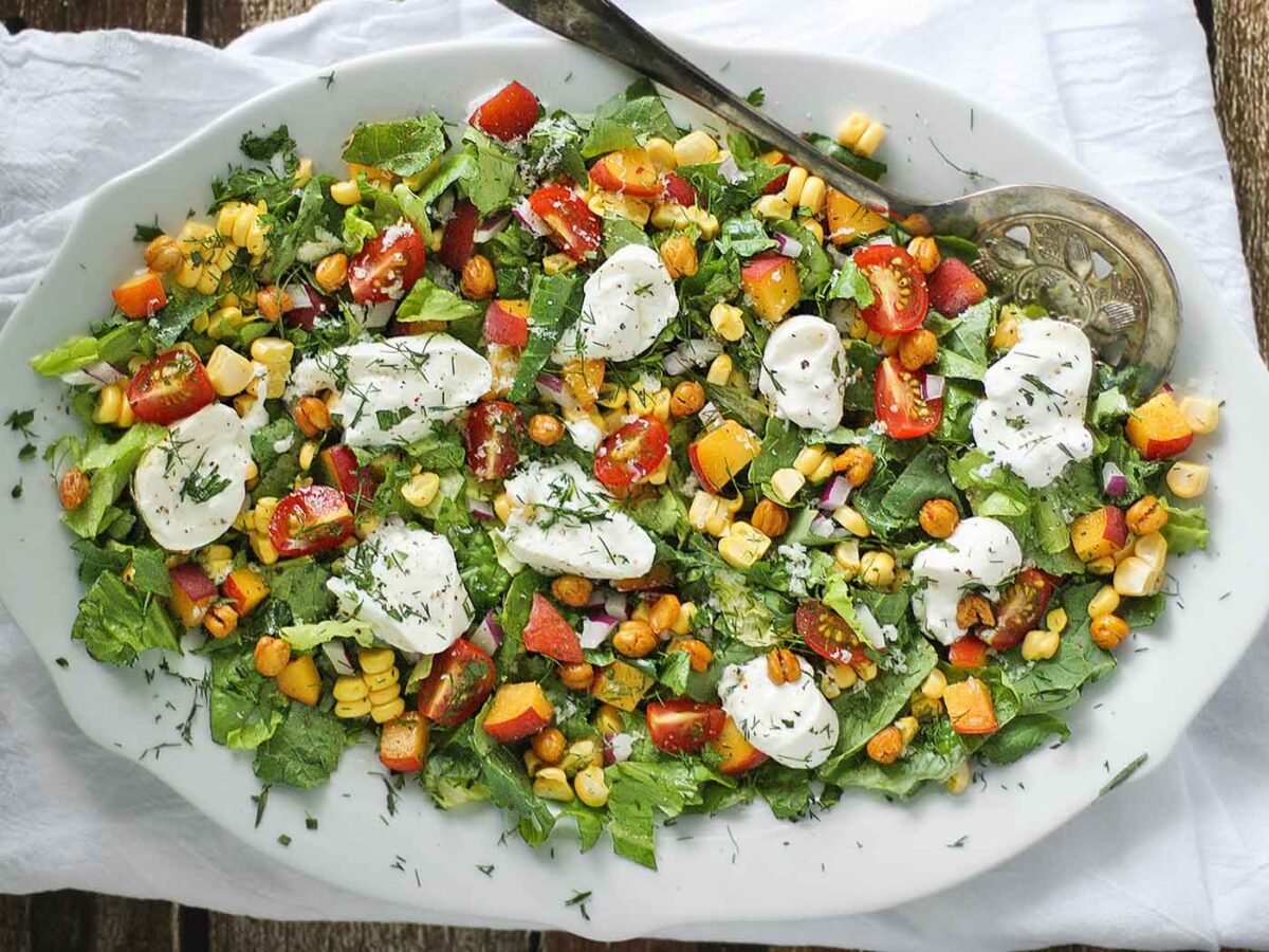 Summer Chopped Salad on a white oval serving platter.