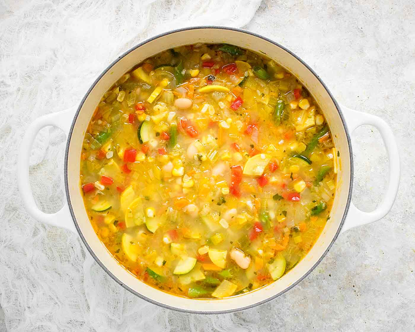 Summer Minestrone in a white Dutch Oven