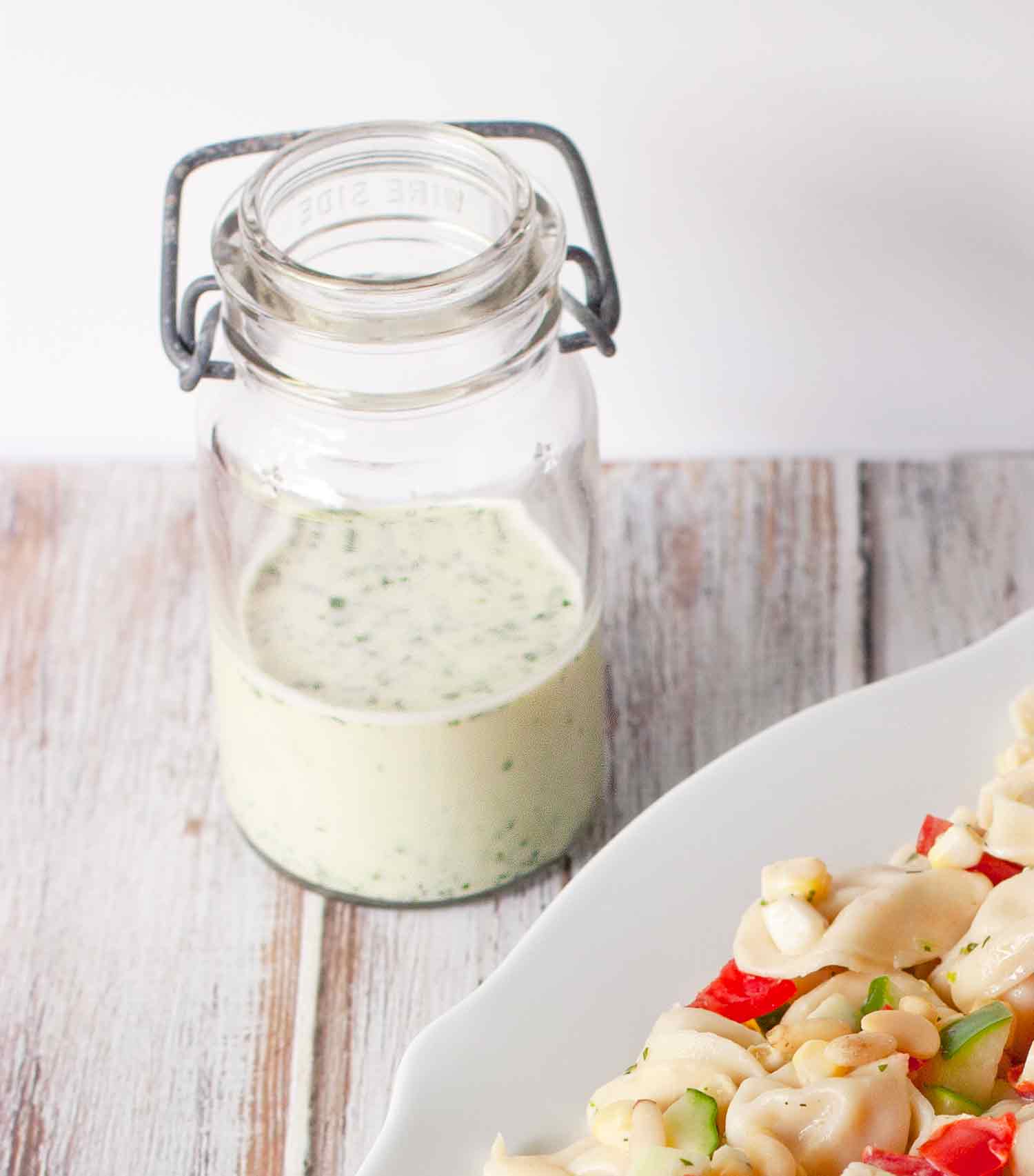 Homemade Buttermilk Dressing in a glass jar.