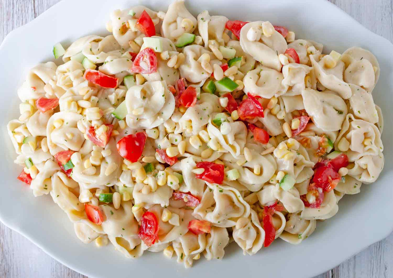Summer Tortellini Salad on a white platter.