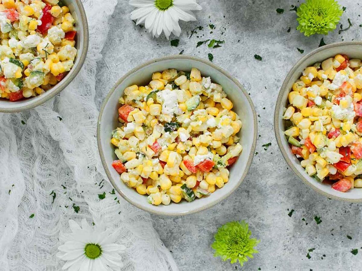 Three small bowls of Sweet Corn Salad.