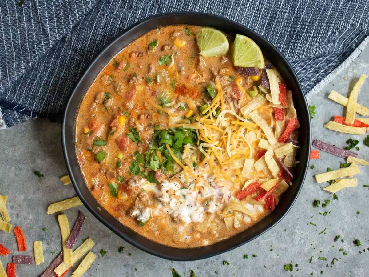 Overhead view of Taco Soup in a black bowl.