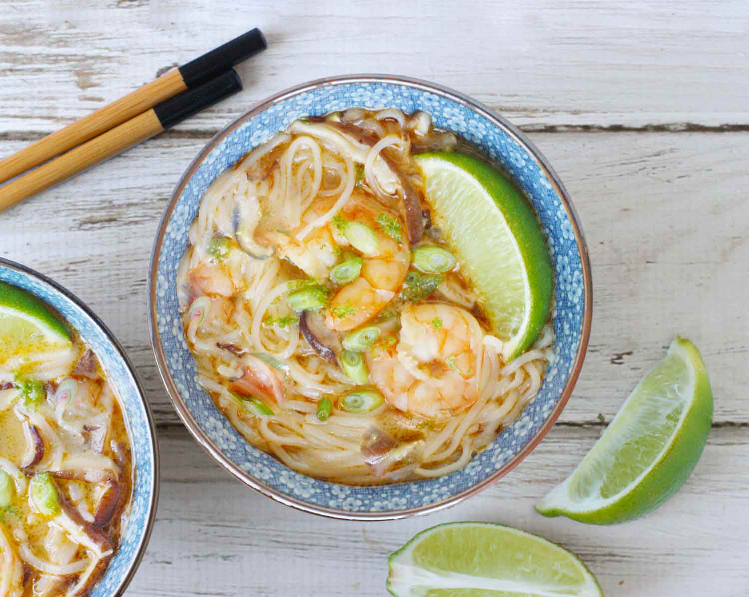 Thai Curry Shrimp Soup with noodles in a blue bowl.