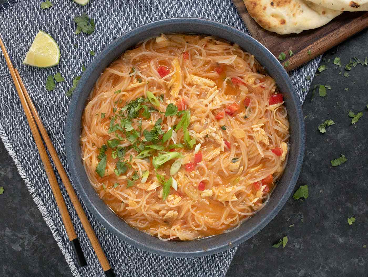 Easy Thai Red Curry Noodle Soup in a stone blue bowl.