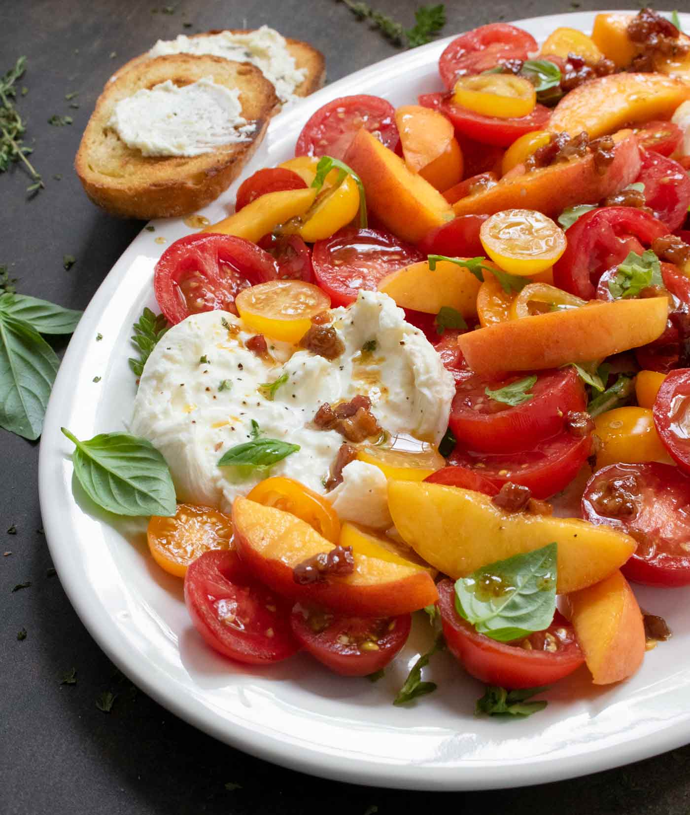 Side angle view of the platter of Tomato Peach Bruschetta Salad.