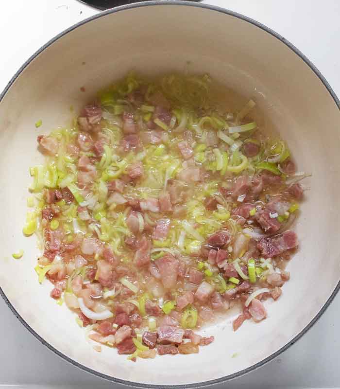 Pancetta and leeks sautéing in the soup pot.