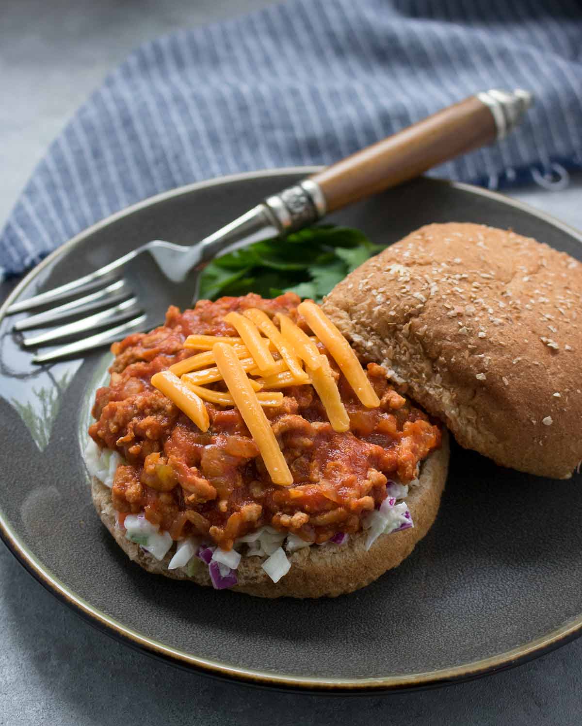 Healthy and delish Turkey Sloppy Joes with cheese and coleslaw, ready to eat! Recipe at SoupAddict.com