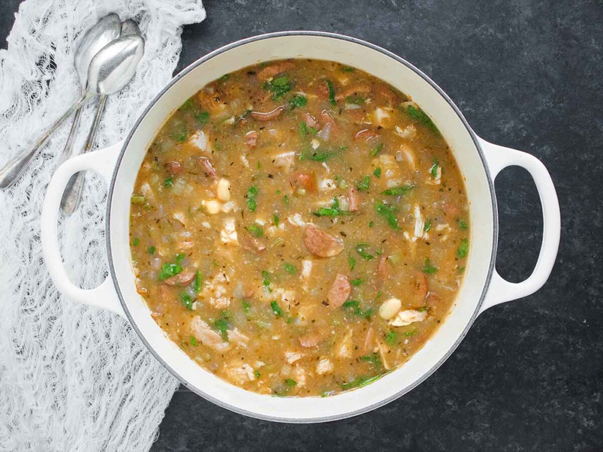 Turkey White Bean Soup in a large white Dutch oven.