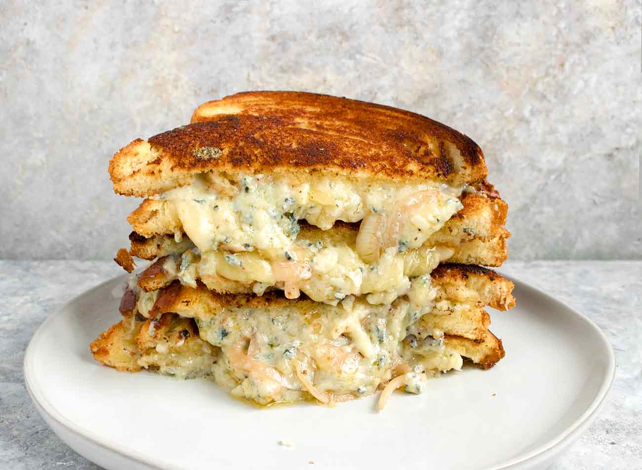 Ultimate grilled cheese sandwich on a plate