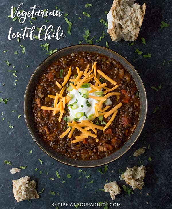 Vegetarian Lentil Chili - hands-down, my favorite vegetarian chili, ever. Lentils cooked in a rich curried bbq sauce with savory vegetables, capped with your favorite toppings. Healthy and delicious. Recipe at SoupAddict.com | lentils | chili | vegetarian | vegan | food in bowls