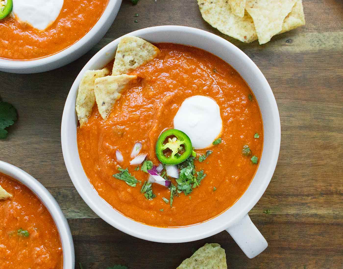 Close-up of a bowl of Vegetarian Tortilla Soup with toppings