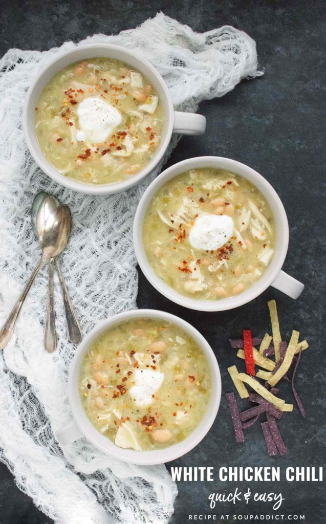 Three bowls of white chicken chili.